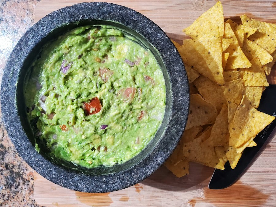 Bowl of guacamole with tortilla chips