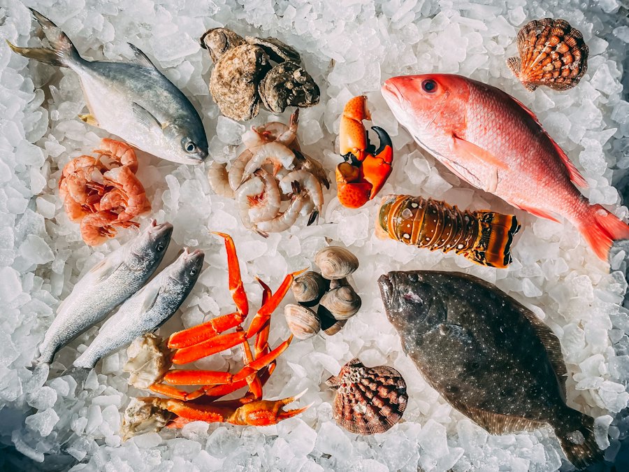Fresh fish, crab legs, shrimp and shellfish on crushed ice