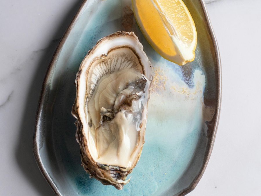 Oysters on the half shell with a lemon wedge